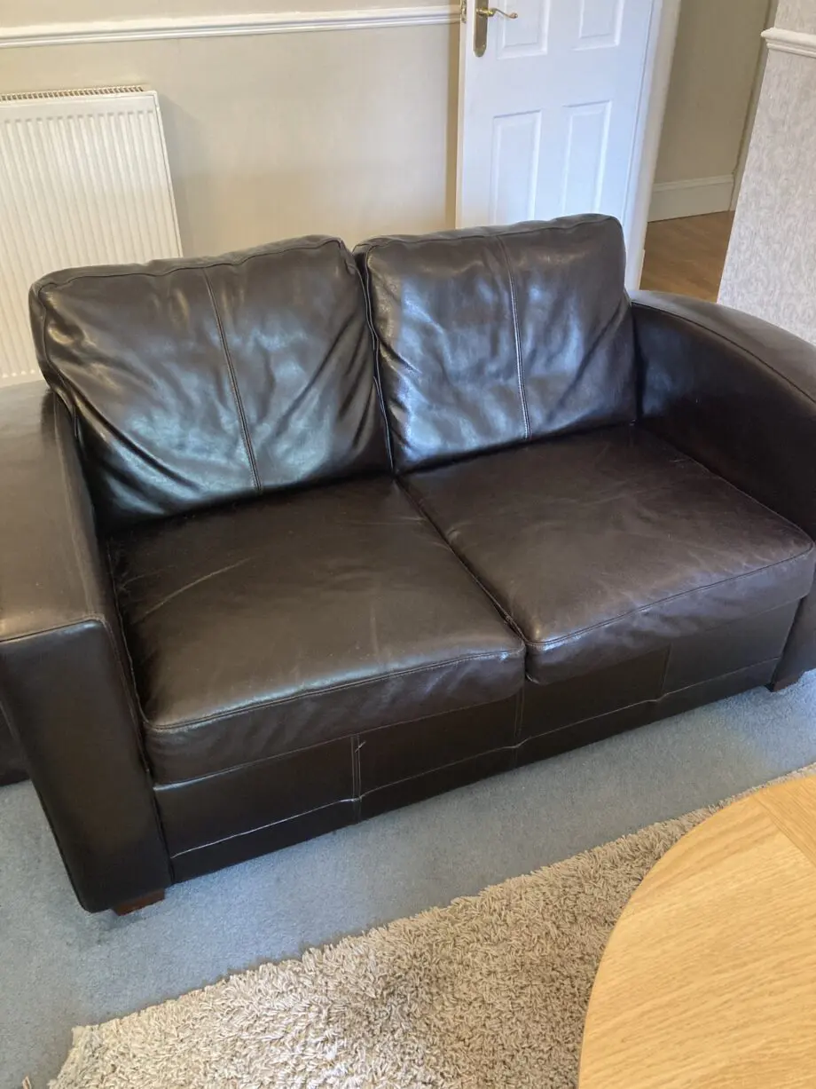 Very dark brown leather two seater matching sofas