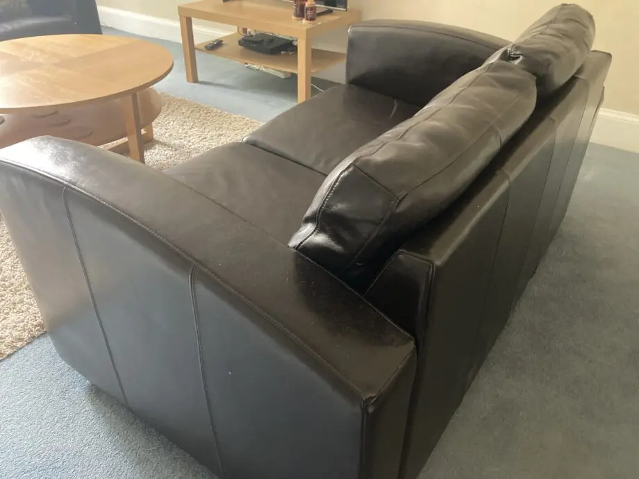 Very dark brown leather two seater matching sofas