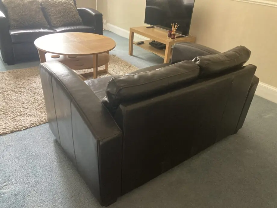 Very dark brown leather two seater matching sofas