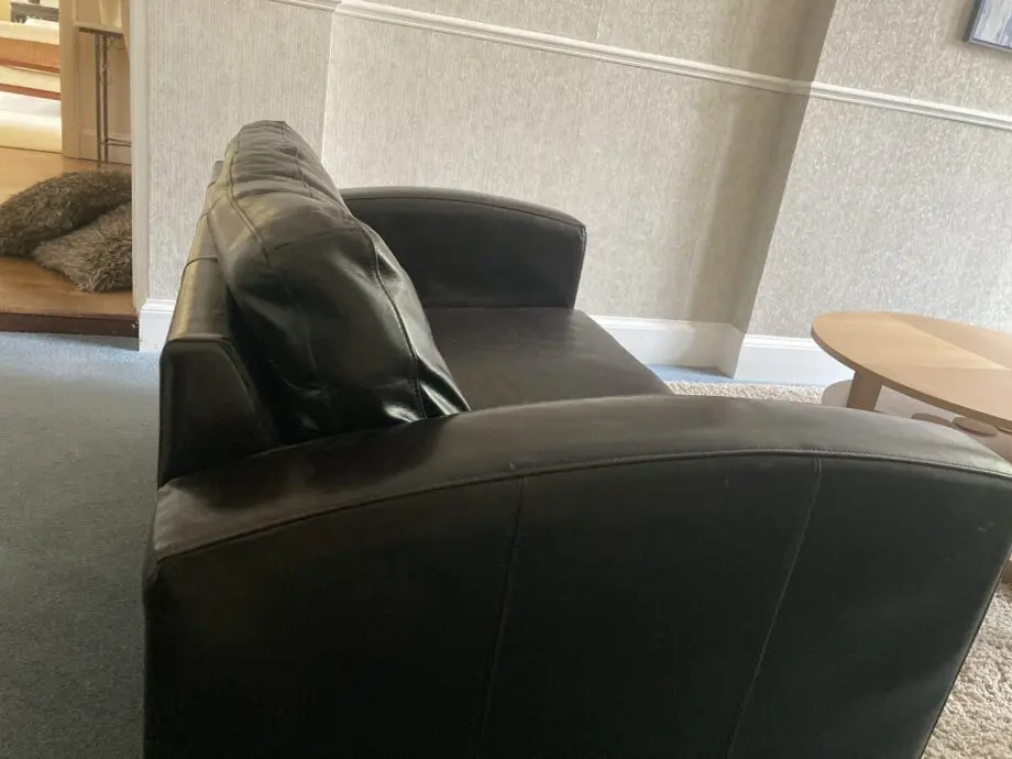 Very dark brown leather two seater matching sofas