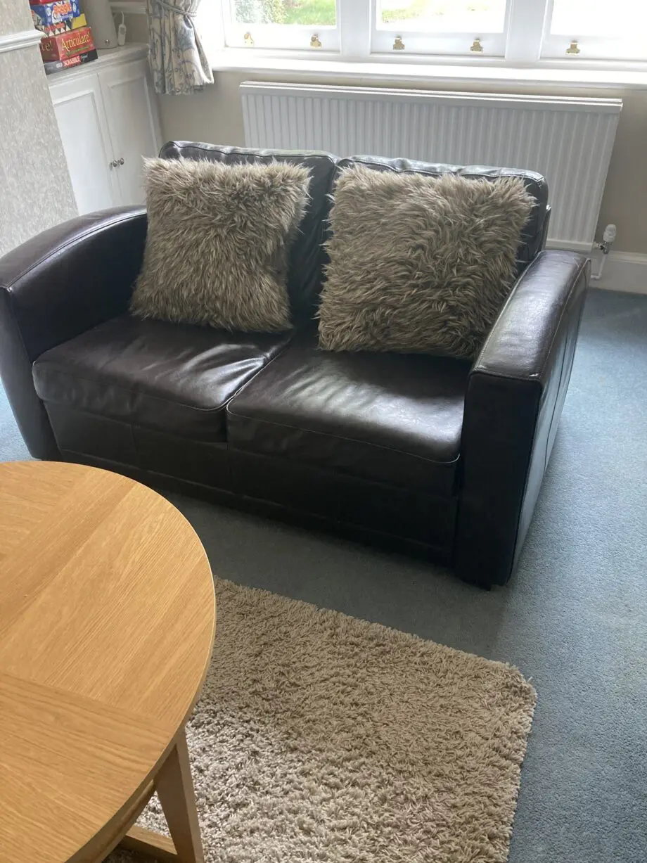 Very dark brown leather two seater matching sofas