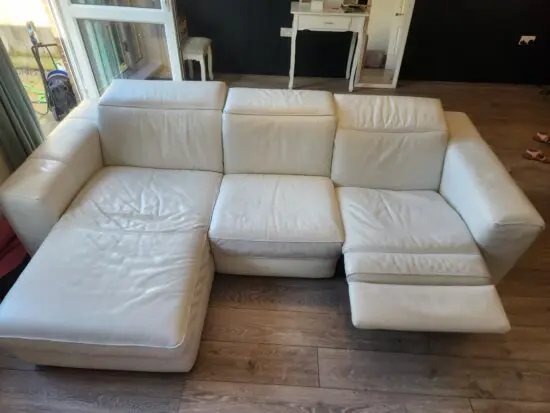 Must go by 23/7 Natuzzi white leather corner sofa with recliner