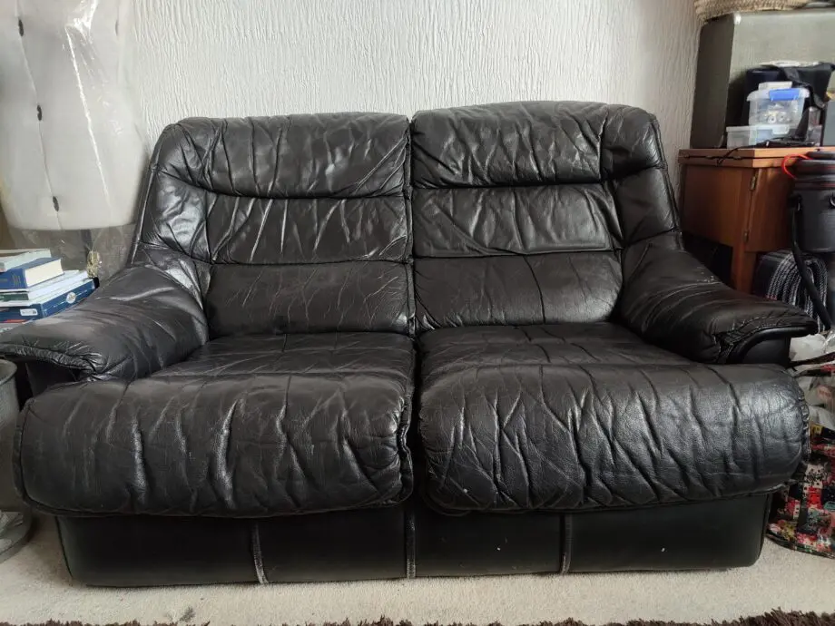 Black Leather 2 seater sofa.