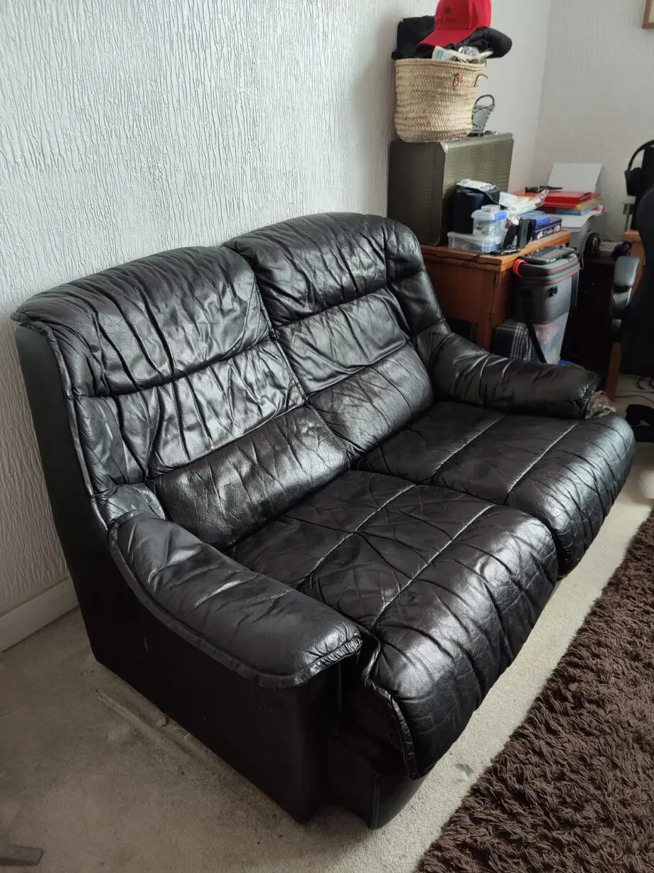 Black Leather 2 seater sofa.