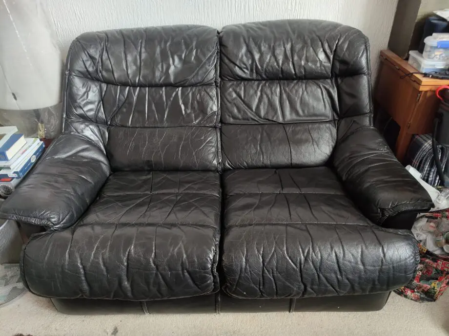 Black Leather 2 seater sofa.