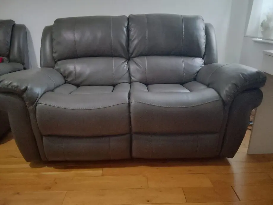 Dark grey leather 2 seater recliner sofar