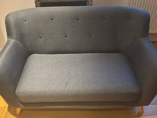 Two seat navy blue sofa