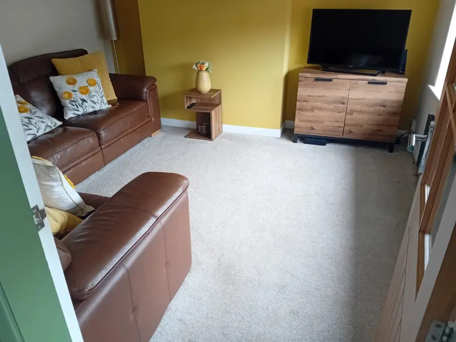 DFS deep brown leather corner sofa.