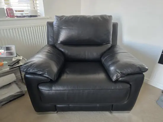 DFS Falcon armchair, electric recliner chair in Black leather