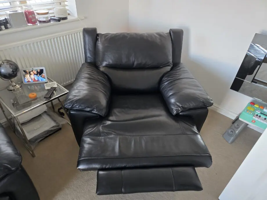 DFS Falcon armchair, electric recliner chair in Black leather