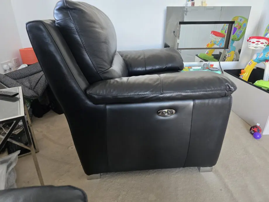 DFS Falcon armchair, electric recliner chair in Black leather