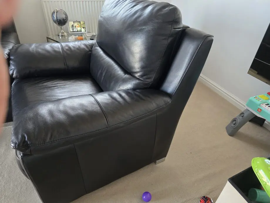 DFS Falcon armchair, electric recliner chair in Black leather