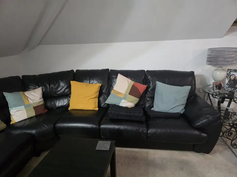 DFS black leather corner sofa