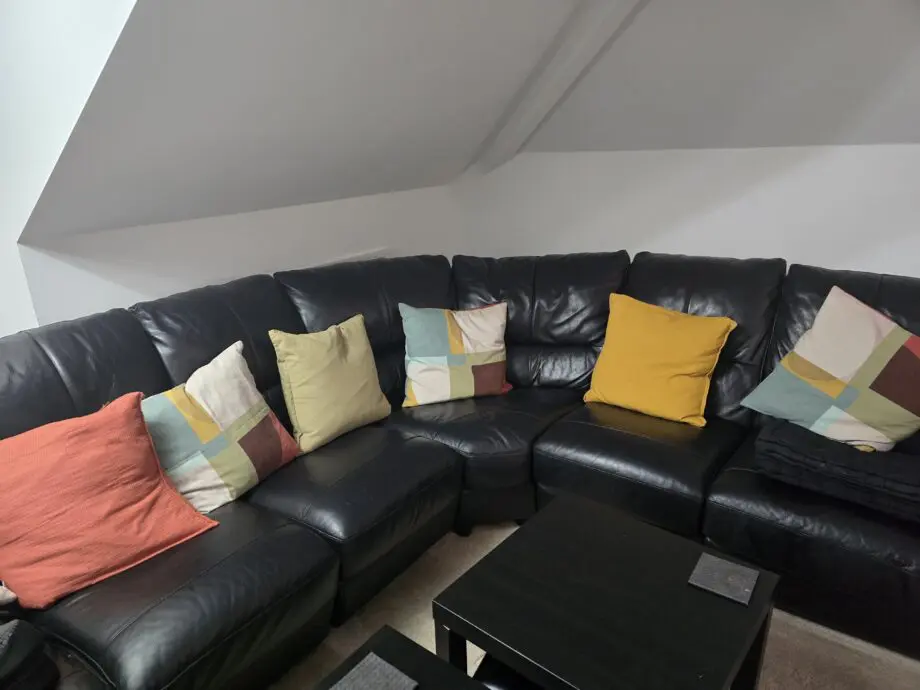 DFS black leather corner sofa