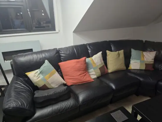 DFS black leather corner sofa
