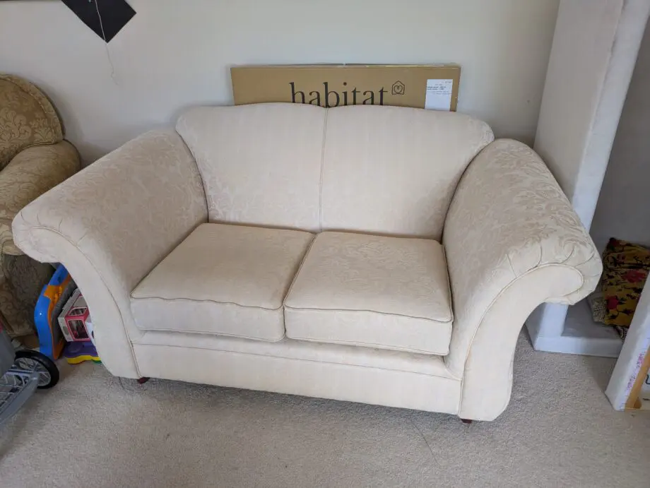 Stylish and comfortable cream sofa in good condition