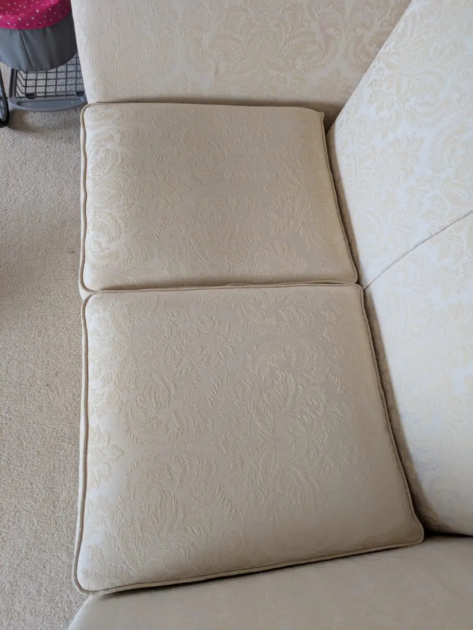 Stylish and comfortable cream sofa in good condition