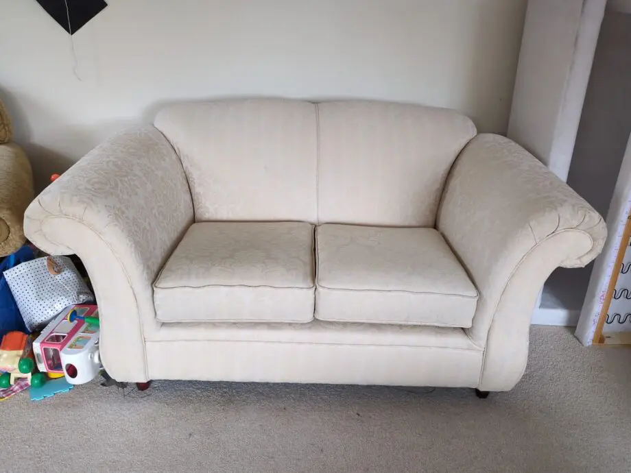 Stylish and comfortable cream sofa in good condition