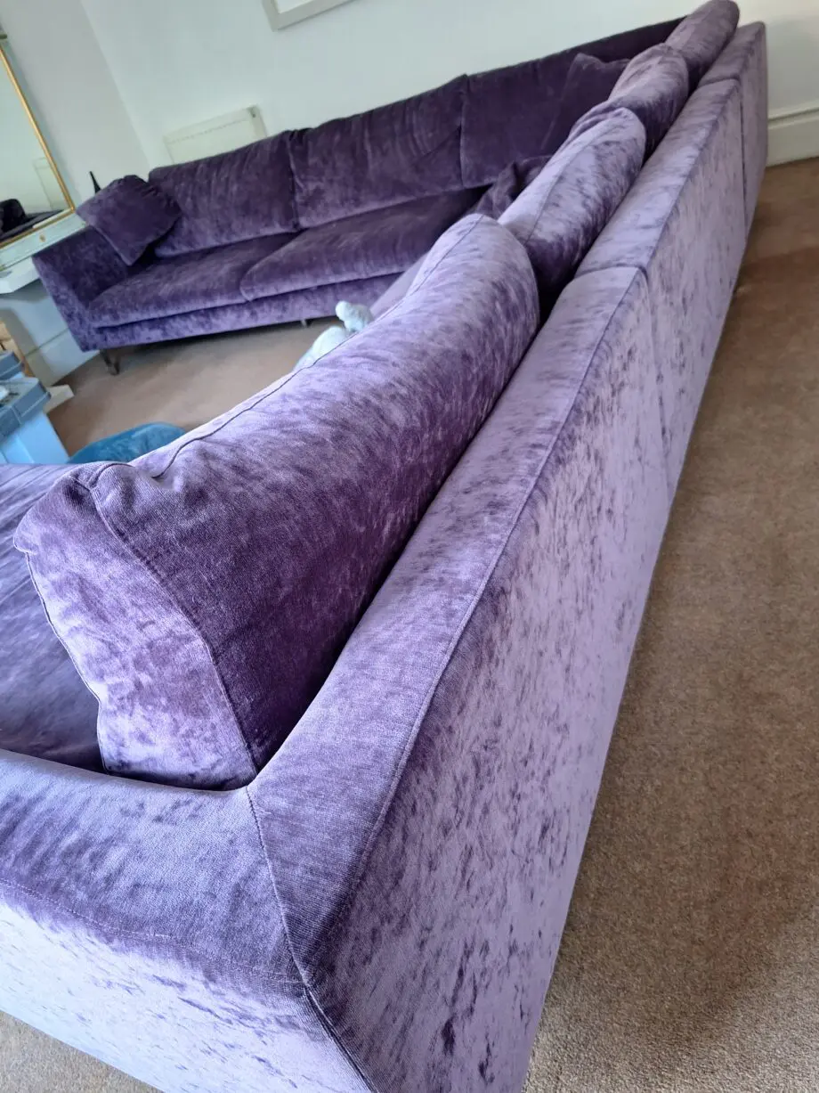 Stocktons steel framed dark purple U shaped settee one side i