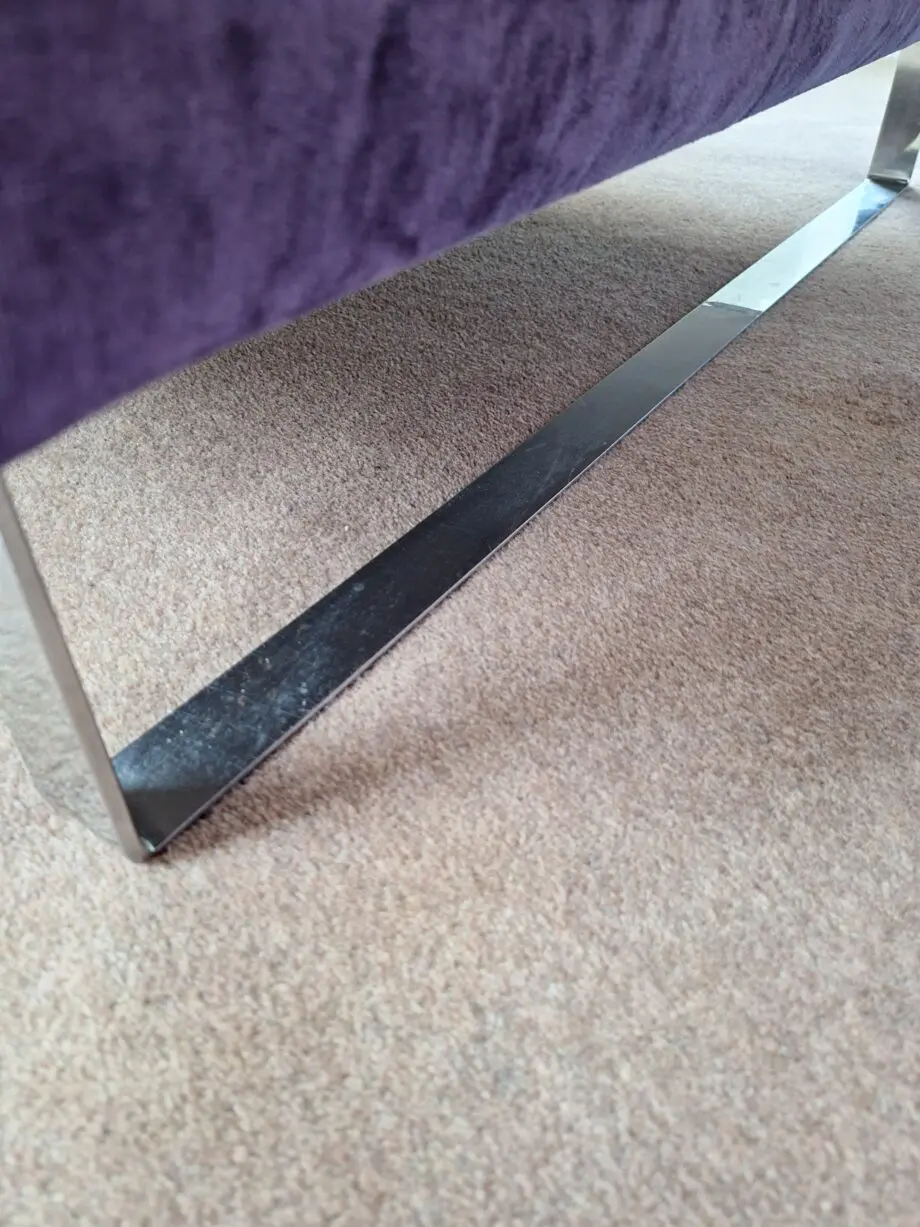 Stocktons steel framed dark purple U shaped settee one side i