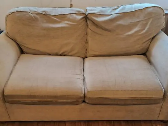 Beige colour 2 seater sofa cum bed