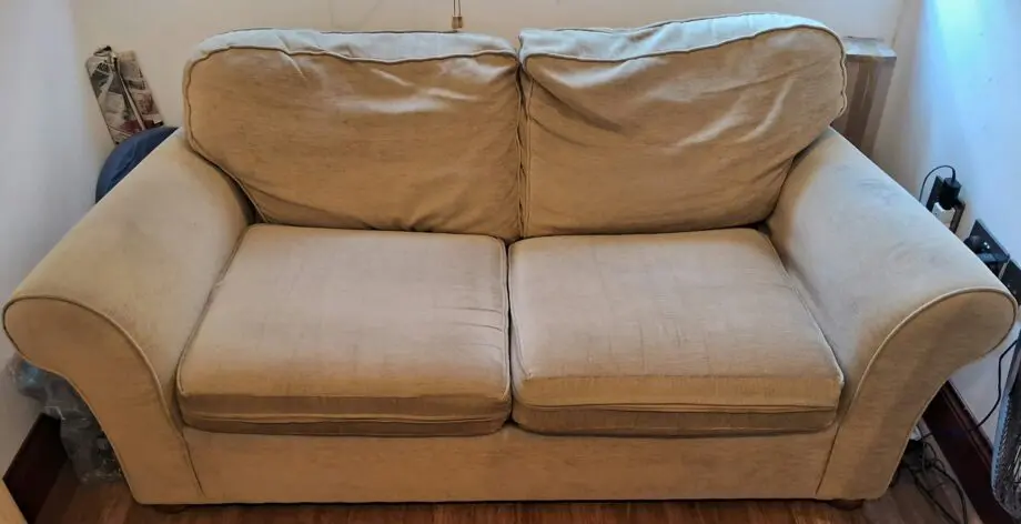 Beige colour 2 seater sofa cum bed