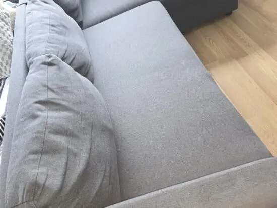 Dark grey L shape sofa bed with storage