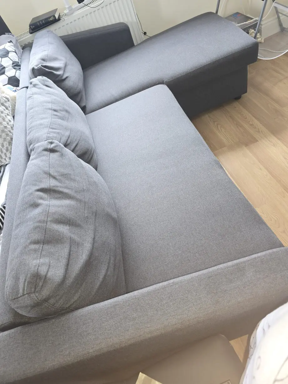 Dark grey L shape sofa bed with storage