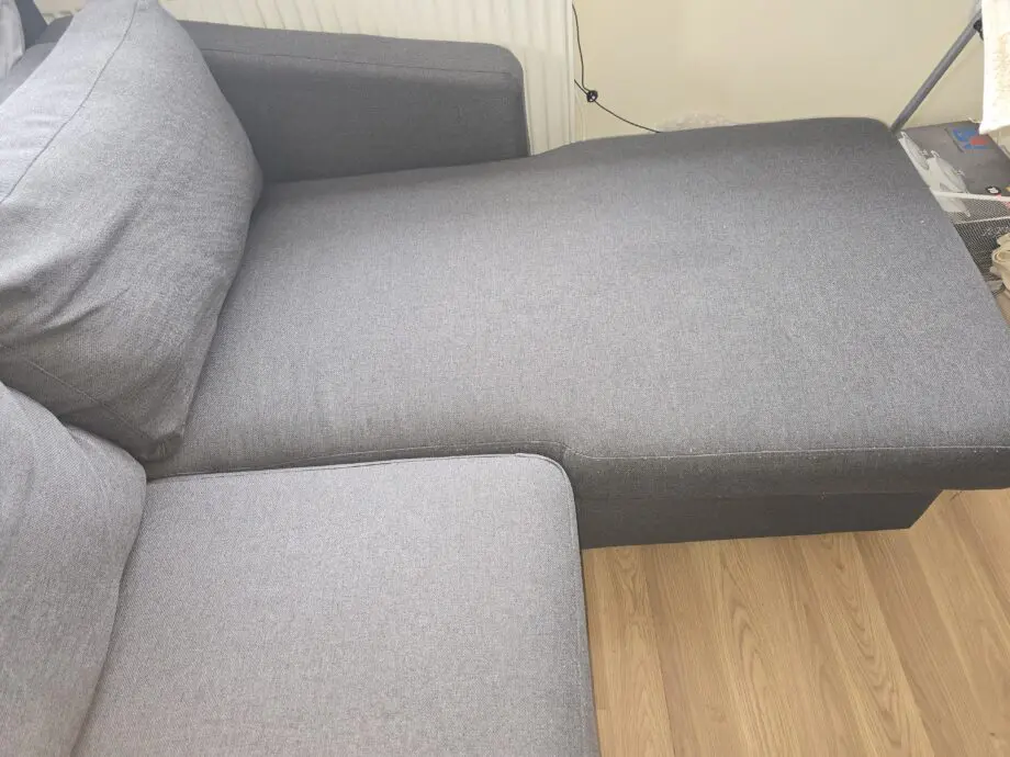 Dark grey L shape sofa bed with storage