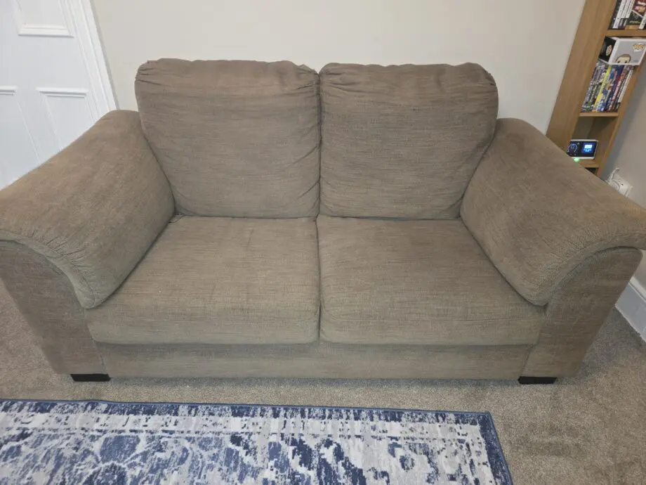 Brown 2 seater sofa. Unknown brand