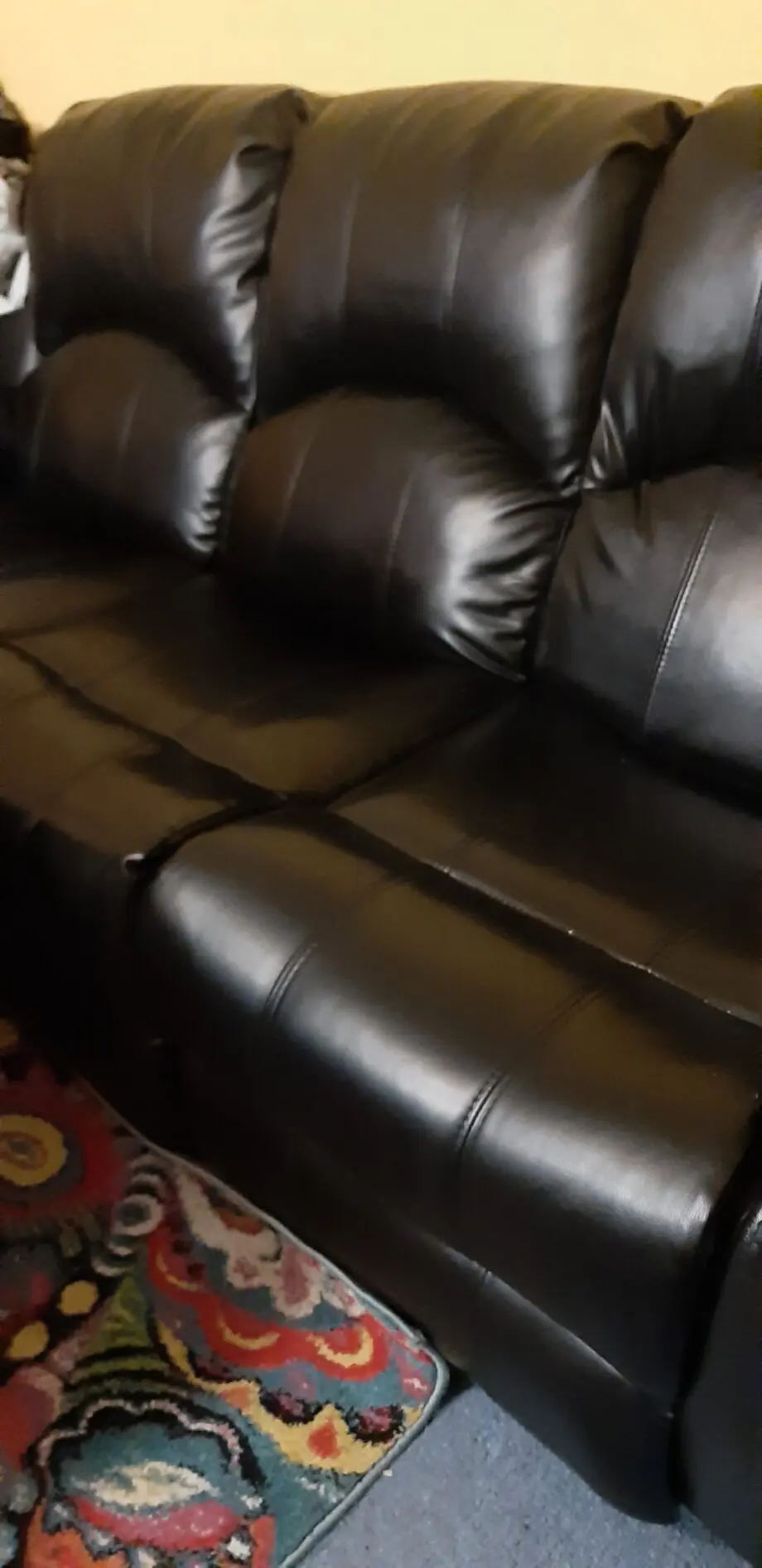 Black faux leather leg recliner Settee.