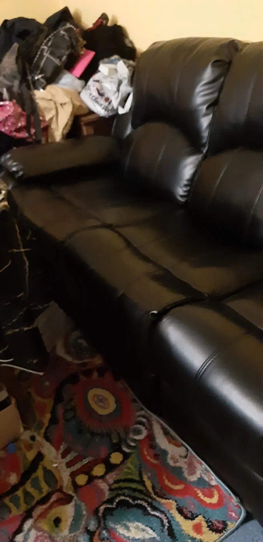 Black faux leather leg recliner Settee.