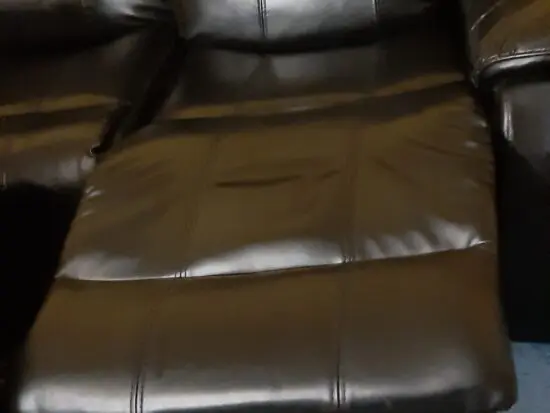 Black faux leather leg recliner Settee.