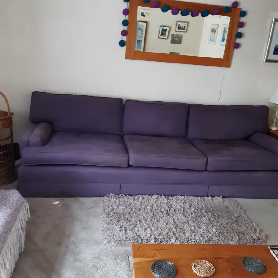 very elegant four seater sofa soft Damson colour