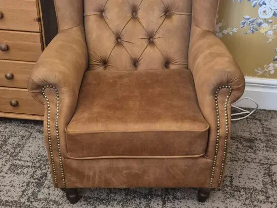 Winged chesterfield chair and footstool