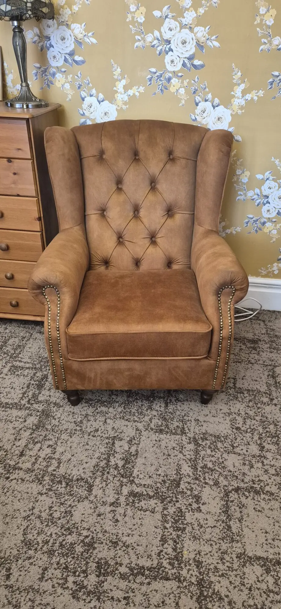 Winged chesterfield chair and footstool