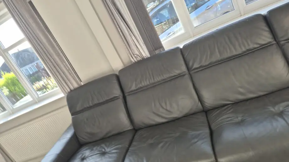 DFS BLACK L SHAPED 4 SEATER SOFA