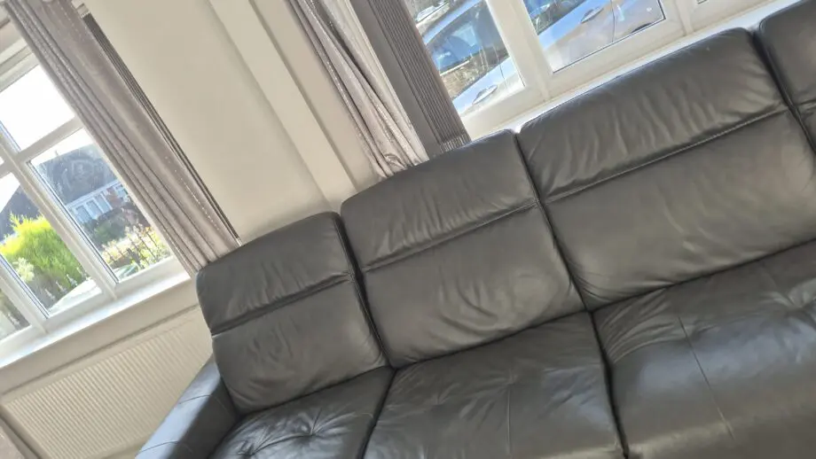 DFS BLACK L SHAPED 4 SEATER SOFA