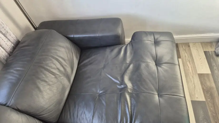 DFS BLACK L SHAPED 4 SEATER SOFA