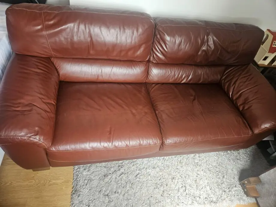 Brown 2x 2 seater leather sofas and footstool with storage
