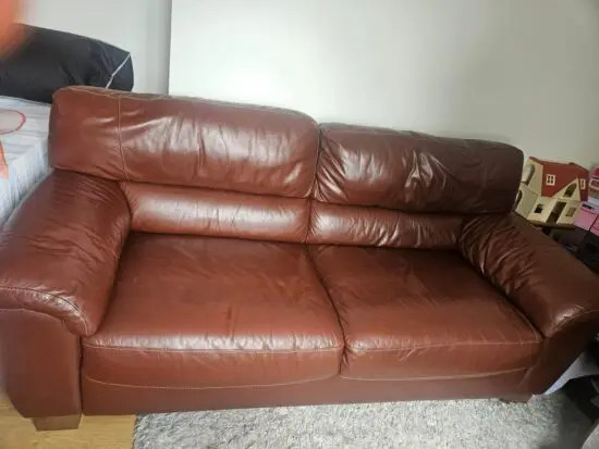 Brown 2x 2 seater leather sofas and footstool with storage