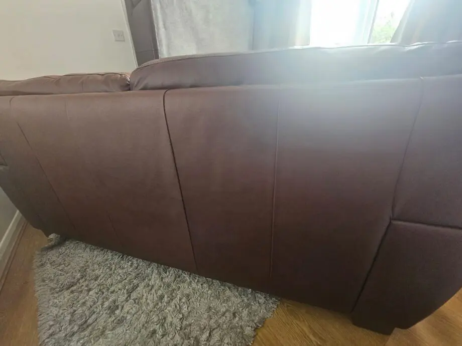 Brown 2x 2 seater leather sofas and footstool with storage
