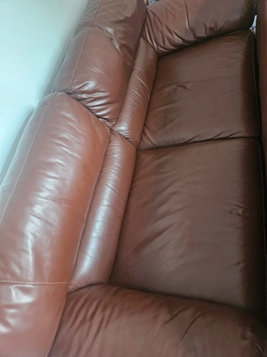 Brown 2x 2 seater leather sofas and footstool with storage