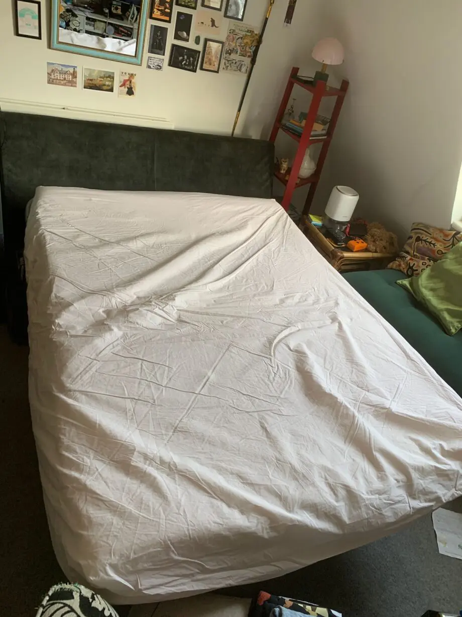 Emerald green two seater sofa bed