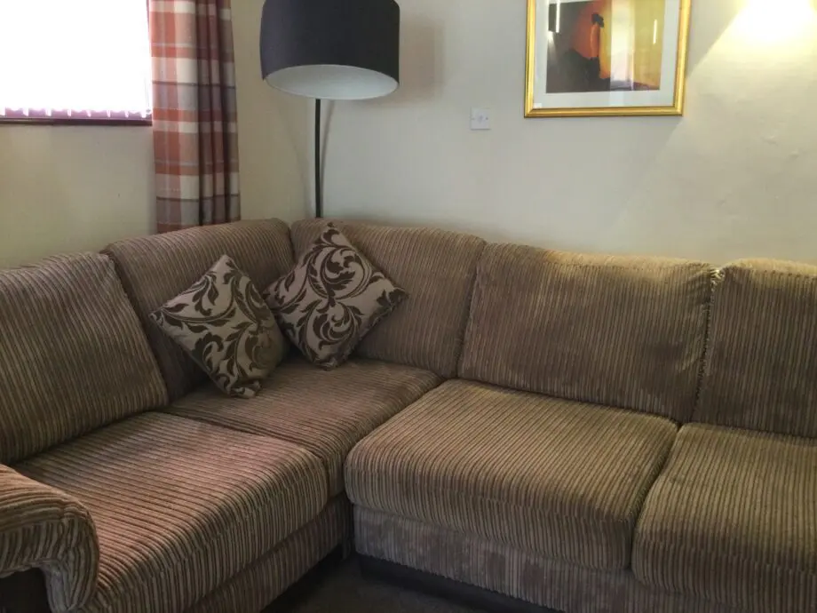 DFS corner suite in cord material beige and brown colour.