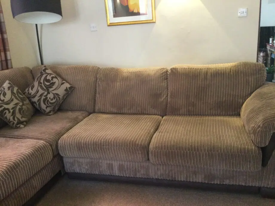 DFS corner suite in cord material beige and brown colour.
