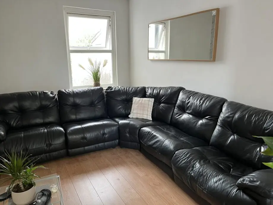 Black Italian leather corner sofa
