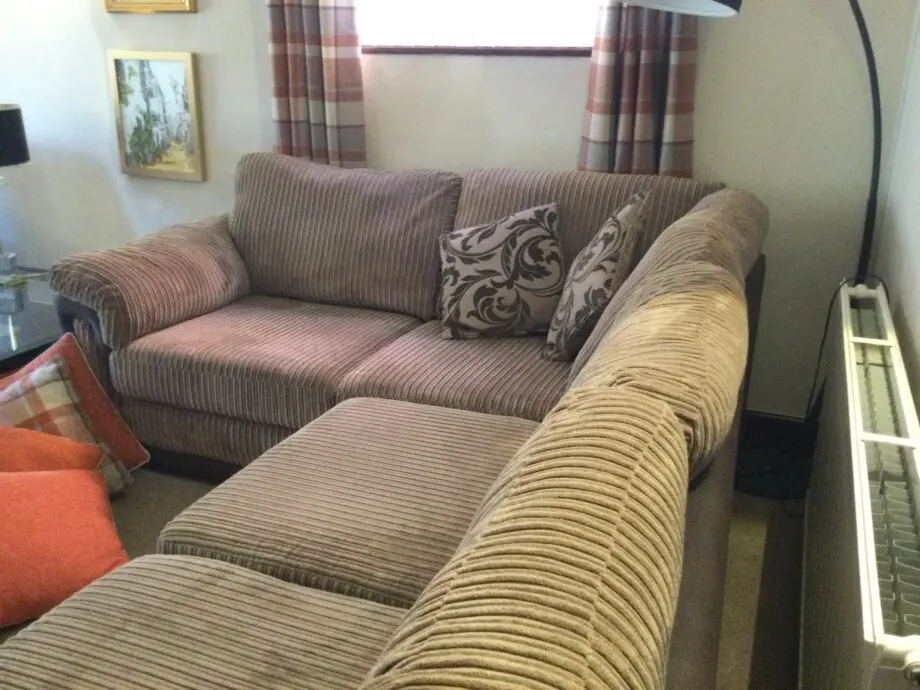 DFS corner suite in cord material beige and brown colour.