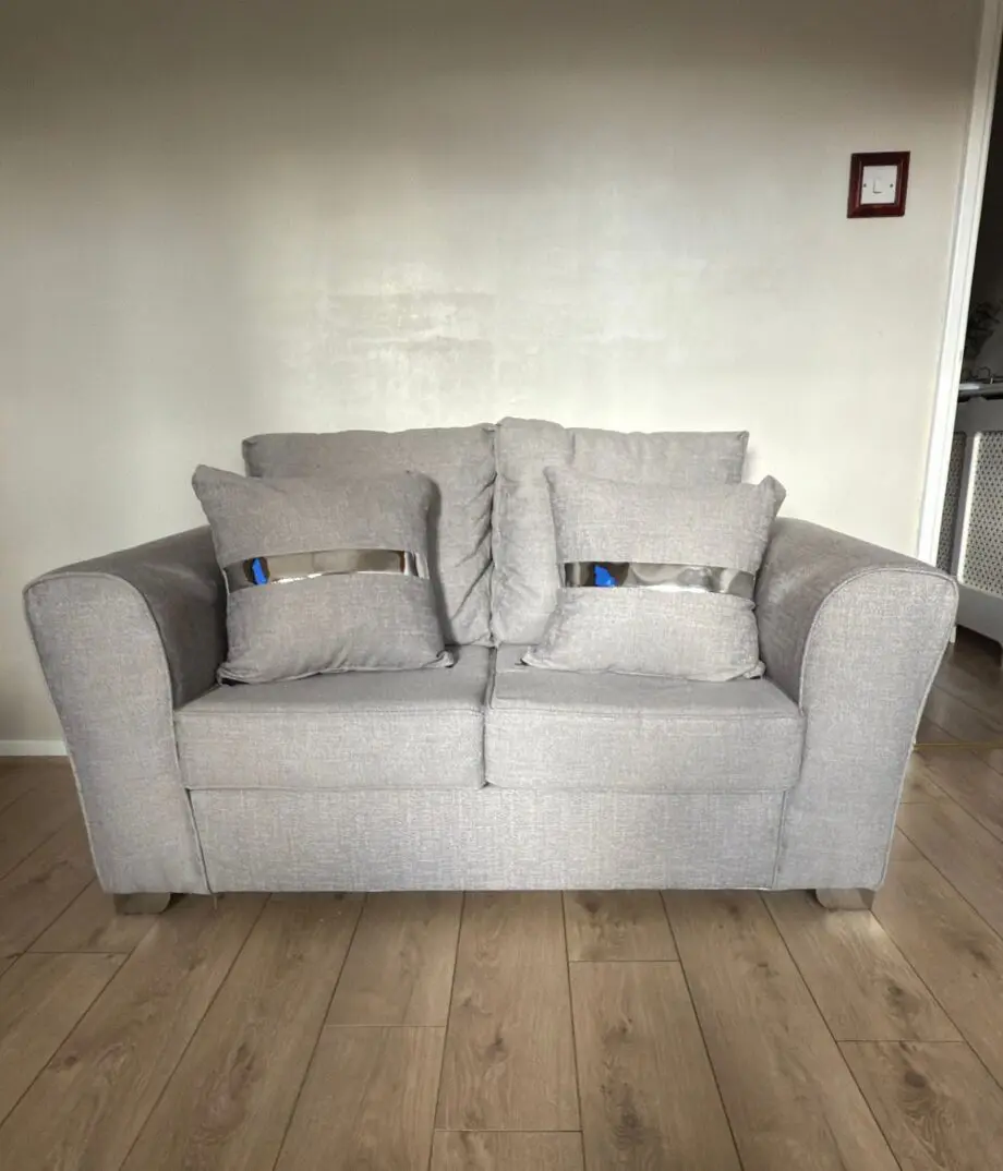 2x2 grey sofa with matching footstall
