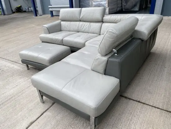 Grey real leather corner sofa and footstool